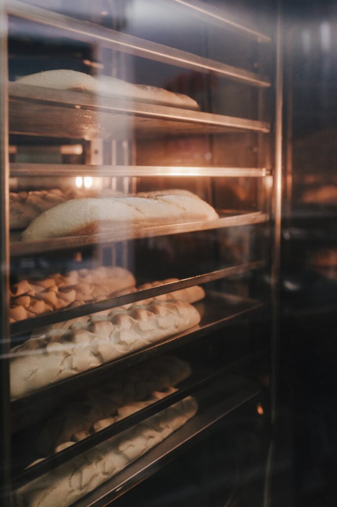 bread baking in oven. Production oven at the bakery. Baking bread. Manufacture of bread
